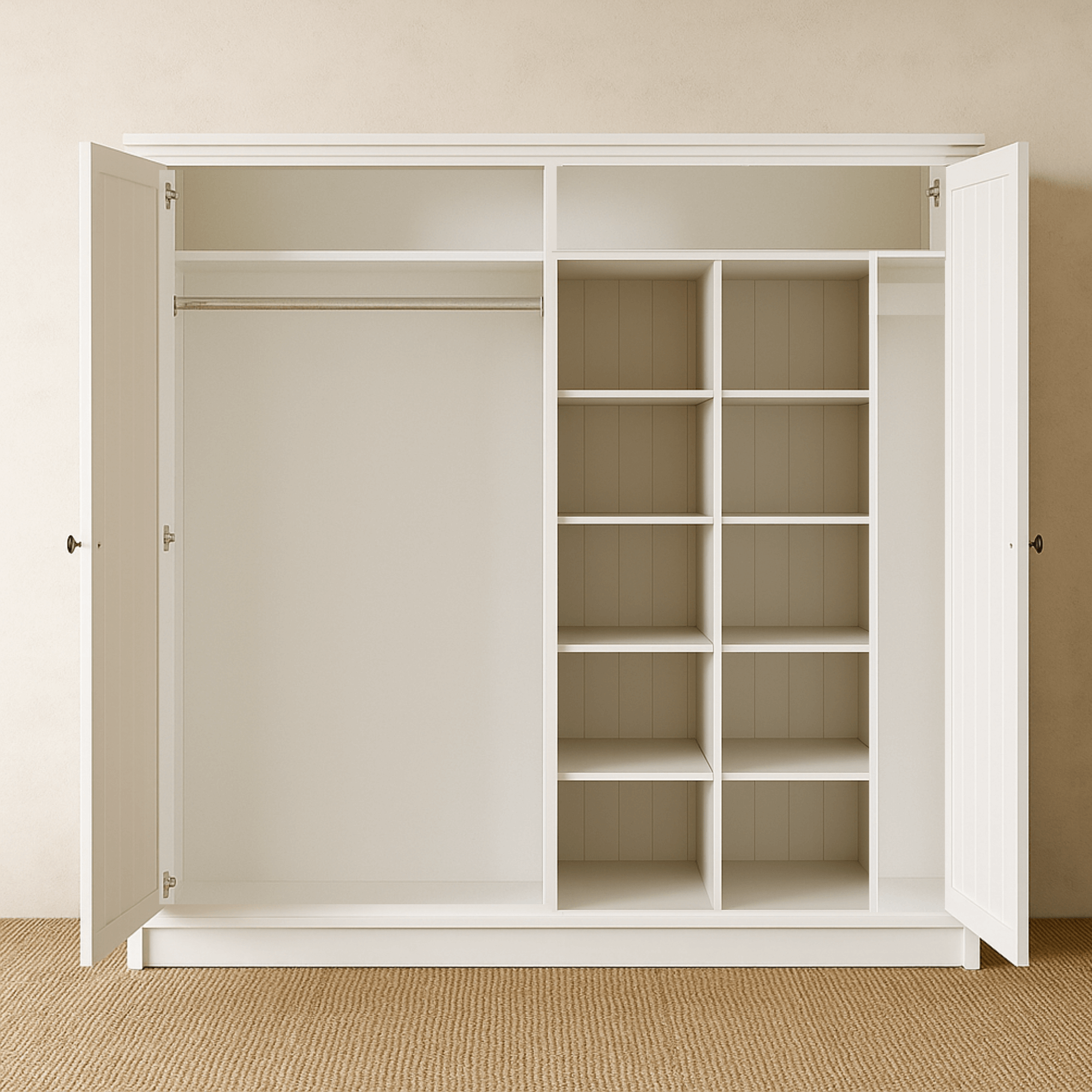 White wardrobe with open doors in a room with beige walls and carpet.
