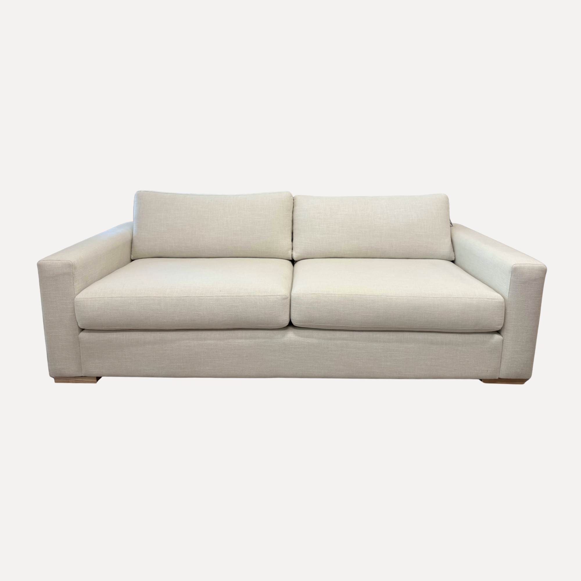 Beige sofa on a white background