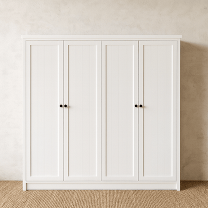 White wardrobe with four doors against a beige wall.