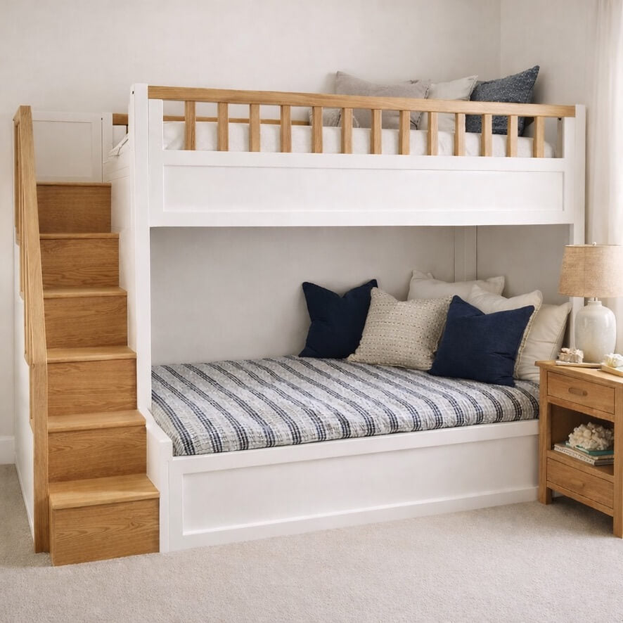 White bunk bed with wooden stairs in a bedroom setting